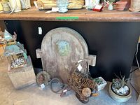 Group shot showing wall plaque, wire bird house, wire basket, water spouts