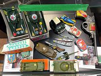 Overview of all ten metal toys displayed on glass shelf