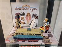 Group shot showing all four tin toys