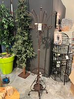 Full view of wrought iron coat & hat rack with umbrella stand