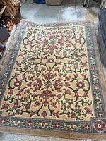Full view of rectangular floral rug showing overall pattern and size