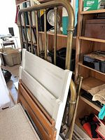 Brass headboard, white wood headboard, brown rails visible