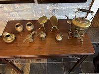 Entire grouping of brass items on table
