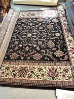 Full view of rug rolled out showing pattern and size