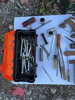 Overall view of toolbox, wrenches, files, sockets, and wooden pieces
