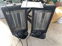 Both Noma heaters side by side showing fronts and bases