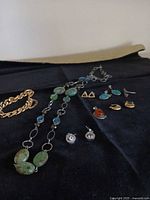All jewellery items laid out on black cloth