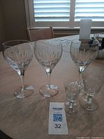 Group of three wine glasses and two cordial glasses