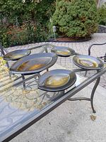 Full set of five salt-fired stoneware pieces on glass table