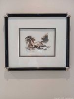 Full view of framed three-dimensional horse artwork on wall