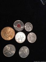 All six coins on black background