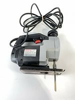 Left side view of Craftsman Professional jigsaw with cord and installed blade