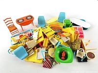 Pile of assorted vintage Barbie scale plastic furniture and accessories