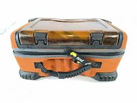 Front view of closed orange and black Plano tackle case with amber lid