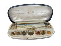 full set in open presentation case showing watch, chain and bezels