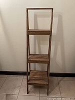 Front view of narrow three-shelf ladder unit