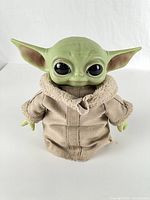 Front view of Grogu plush figure with robe