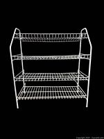 Front view of white metal 4-shelf shoe rack