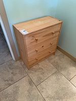 Front view of pine 3-drawer chest