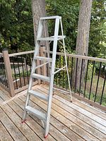 Full view of 6 ft aluminum A-frame ladder standing on deck