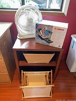Overall lot showing fan, Canon printer box on stand, fabric basket and collapsible hamper