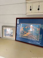 Both framed prints side by side showing relative sizes and frame styles