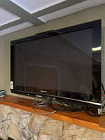 Front view of Panasonic TV mounted on wall