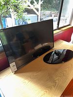 Front view of Samsung TV with detached pedestal stand