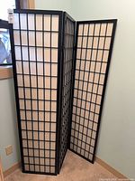 Full view of the three-panel Shoji divider standing partially folded