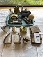 Full assortment of stone items on table and tray