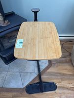 Full view of swing table showing bamboo top, column and base