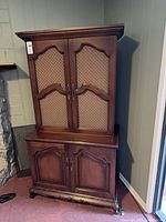 Front view of closed cabinet showing overall design, finish and hardware