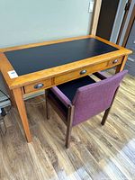 Desk and chair front view showing overall design and scale