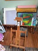 Full view of wooden H-frame floor easel front