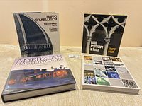 All four books front covers visible