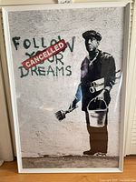 Full view of framed Banksy print