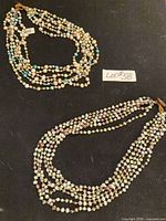 Overview showing both multi-strand pearl necklaces