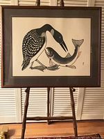 Framed print on easel showing full artwork and frame