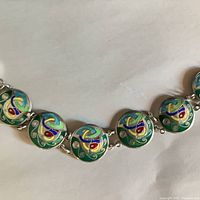 Front view showing enamel Celtic motif links