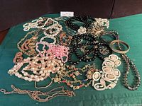 All jewellery pieces spread out showing variety of necklaces, bracelets and chains