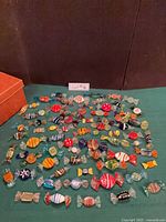 Full layout of all Murano glass candy figurines on table