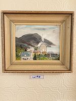 Framed painting hanging on wall