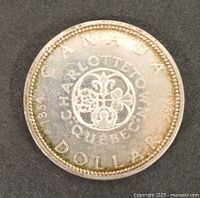 Reverse showing Charlottetown-Quebec floral emblem and dates 1864-1964