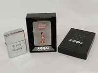 Front view of both lighters and Zippo box