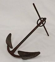 Full view of iron anchor showing ring, stock, shank and flukes