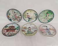 Front view of all six plates showing designs