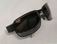 Angled view showing front and left temple with Maui Jim logo