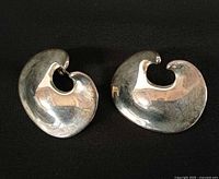 Front view of both sterling silver earrings showing swirl design