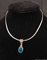 Full view of sterling collar necklace with pendant attached
