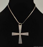 Front view of cross pendant on chain